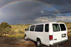 A rainbow over a Southwest Tours van while on tour