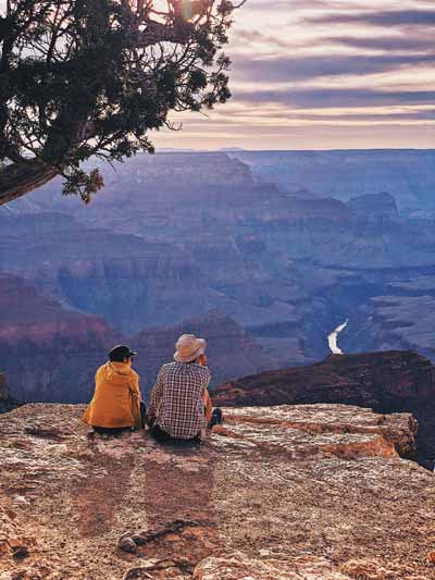 Grand Canyon tour feature photo. A beautiful view overlooking the Grand Canyon with some snow